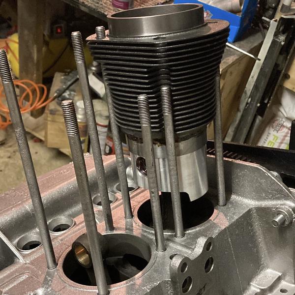 Installing the pistons and barrels on the engine.